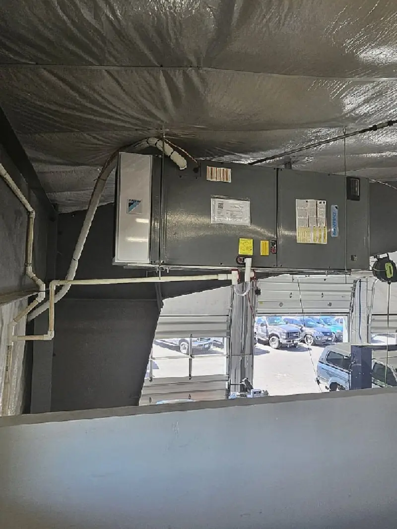 Suspended Daikin air handler installed in a commercial shop by Central Washington Heating and Air
